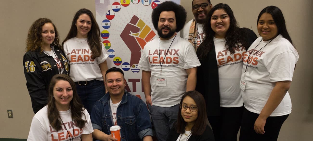 A large coalition of Latinx Leads students gathered beneath the flags banner