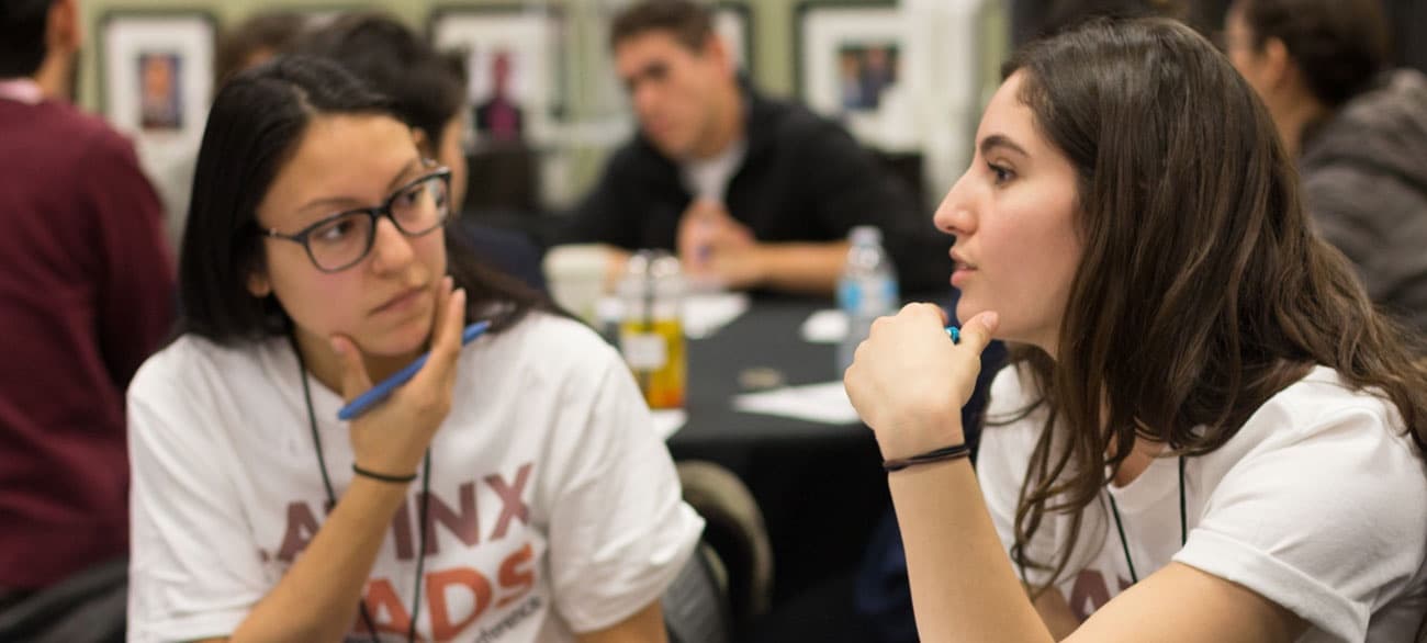 Students engaged in active discussion during a learning session